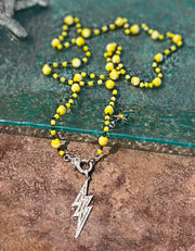 Faceted, fire polished yellow Czech glass bead chain with pave diamond lobster clasp and lightning bolt pendant
