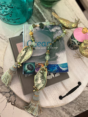 Gemstone and oyster decoupage garlands