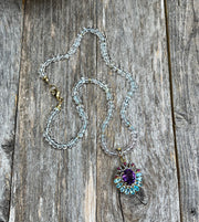 Knotted pastel aquamarine gemstone necklace with amethyst, diamond, ruby and blue topaz pendant