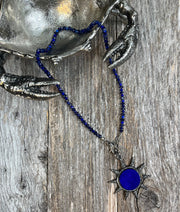 Sol Azul - Blue sapphires and blue lapis lazuli hand-knotted gemstones with a large blue lapis lazuli and pave diamond sun pendant and pave diamond lobster clasp