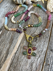 Santa Barbara - Precious and semiprecious knotted gemstone bead necklace with a one-of-a-kind sapphire and diamond flower pendant