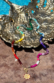 Positano - 8-10mm hand-knotted semiprecious gemstone rainbow bead necklace with pave diamond clasp and ruby and pave diamond evil eye pendant