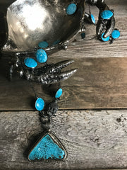 Turquoise howlite gemstone chain, black spinel skull lobster clasp.  Tibetan silver and turquoise howlite pendant.