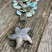 Hand-carved blue lace agate gemstone starfish pendant with larimar gemstone bezel chain