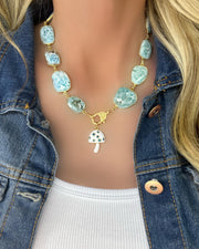 Stunning, large cut larimar gemstone bezel necklace with pave diamond lobster clasp and turquoise gemstone and enamel mushroom charm