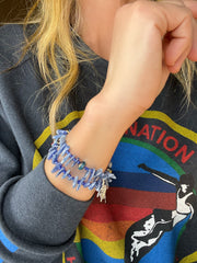 Ocean blue kyanite gemstone spike-shape beads, double-strand bracelet with sterling silver charms