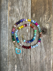 Candy-O  Hand-knotted semiprecious gemstone bead rainbow necklace with baby blue enamel evil-eye lobster clasp and 14k gold-filled endings