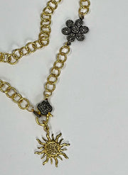 Lightweight and versatile, gold link chain with pave diamond flower connector, pave diamond lobster clasp and pave diamond sun pendant