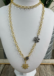 Lightweight and versatile, gold link chain with pave diamond flower connector, pave diamond lobster clasp and pave diamond sun pendant